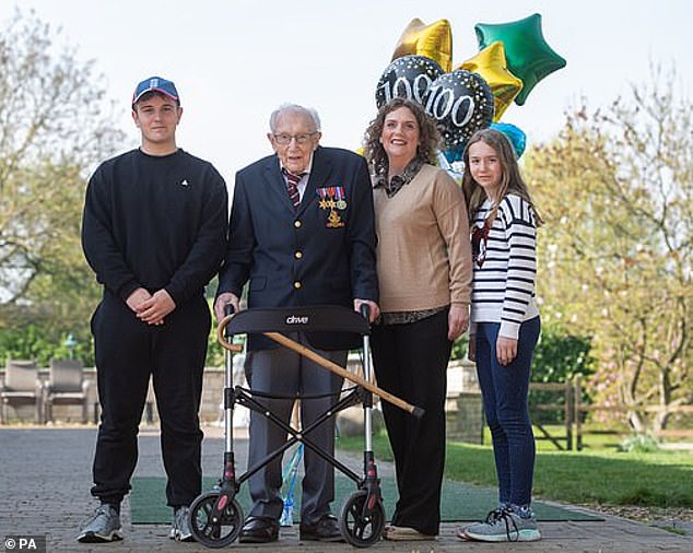 Colonel Tom, pictured with his grandson Benji, daughter Hannah and granddaughter Georgia, received a special nomination for knighthood from the Prime Minister