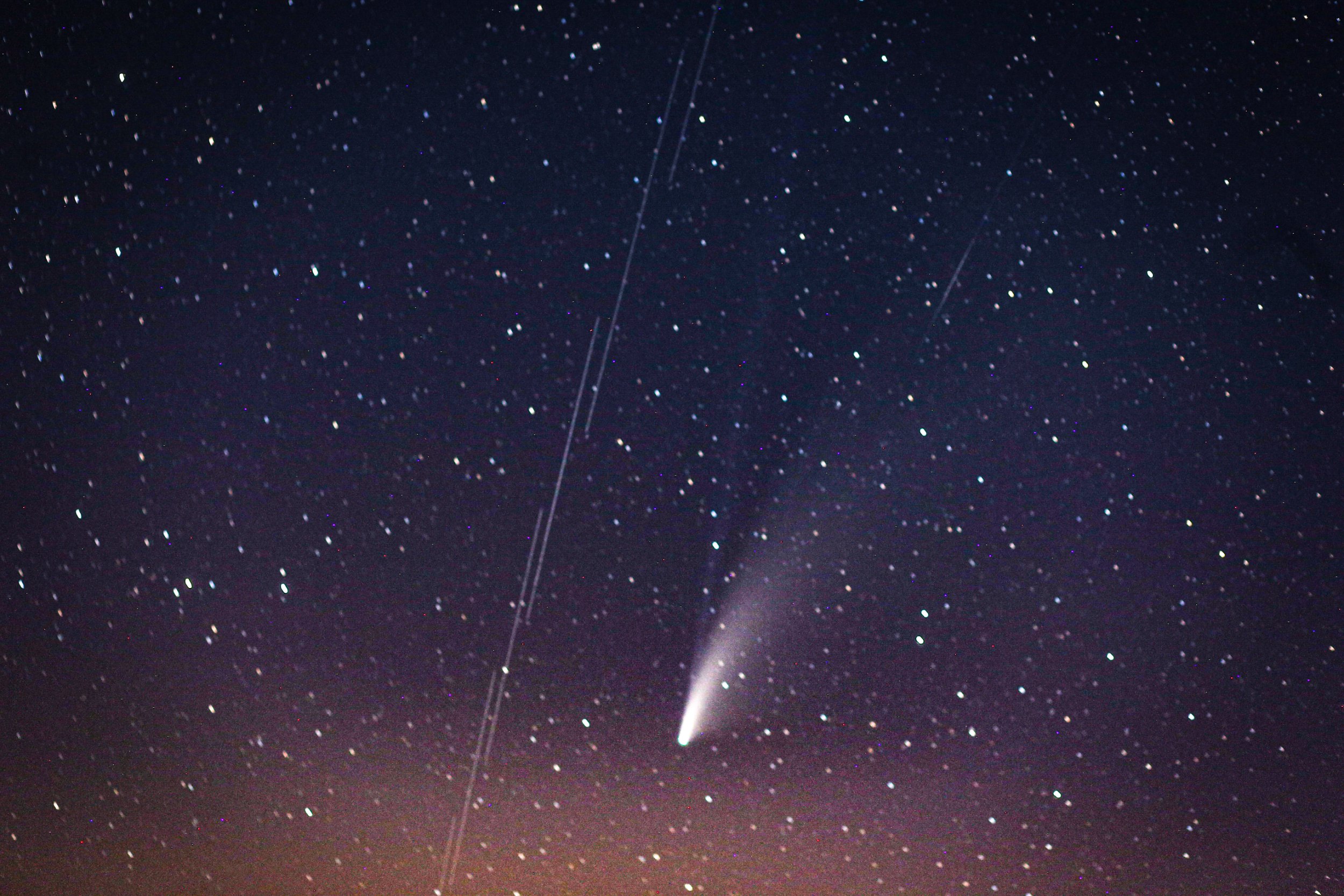 IDLIB, SYRIA - JULY 20: Comet Neowise, the "C / 2020 F3 Neowise comet" is observed over the sky in Idlib, Syria on July 20, 2020. The "C / 2020 F3 Neowise comet", named after the "NEOWISE" recently discovered comet by telescope of the US Aviation and Space Agency. (Photo by Muhammed Said/Anadolu Agency via Getty Images)