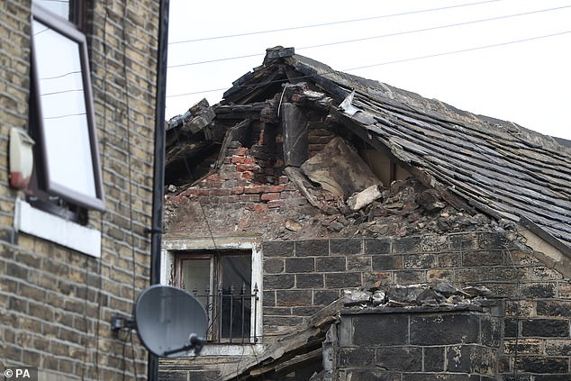 The chimney collapsed off the roof of the house at 5.06am in high winds and rain