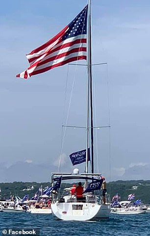 During the parade, a boat capsized waving Trump's 2020 flag