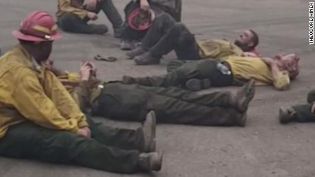 Tired firefighters sing together after a 14-hour shift in a wildfire fight in Oregon 