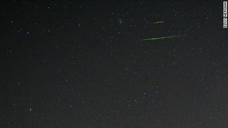 Sometimes Leonid meteors can cross the sky in brilliant colors.  The color of the meteorite depends on the metal of the meteorite, and for these green colors, according to NASA, it was probably magnesium. 