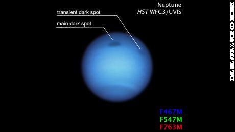 The small dark spot in this Hubble figure may be a fragment of a giant storm that broke as it approached the larger rotating equator. 