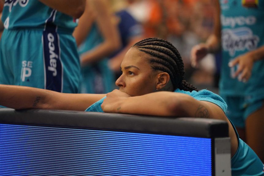 Liz Cambez sits on the bench during the WNBL's spectacular final between the Southside Flyers and the Townsville Fire.