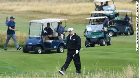 Trump walks as he plays a round of golf on the Ailsa course at Trump Turnberry.