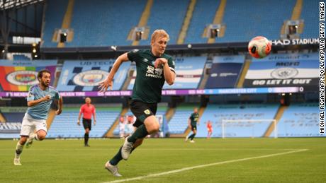 Ben Mee chases the ball during Burnley&#39;s 5-0 defeat by Manchester City. 
