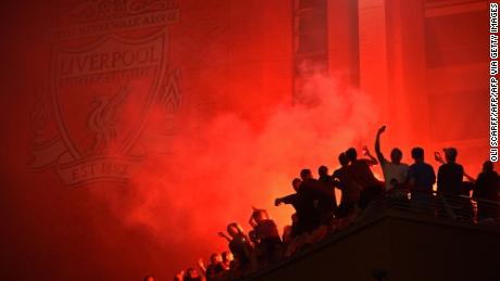 Fans outside Anfield, celebrating Liverpool&#39;s historic win. 