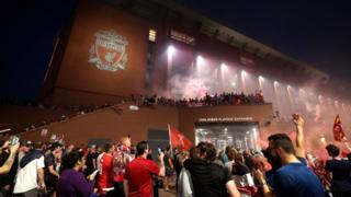 Liverpool fans celebrate outside Anfield