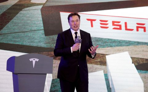 Tesla shares hit record closing price