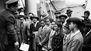 Jamaican immigrants welcomed by RAF officials at Tilbury Docks, Essex, on 22 June 1948