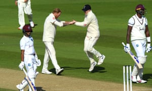 Stokes celebrates with Dom Bess after taking the wicket of Holder for five.