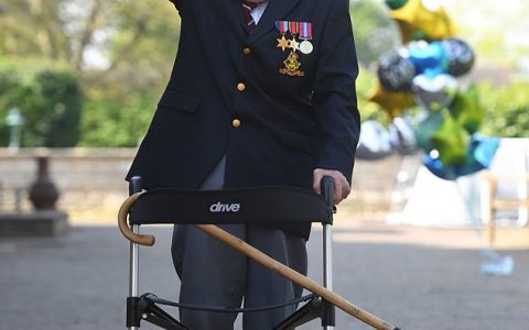 Colonel Tom Moore, pictured above, will travel to the Berkshire royal residence with members of his family for the rare investiture with the monarch on Friday
