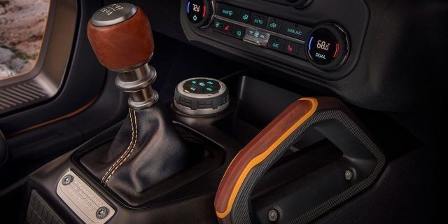 Customization details include an available leather-wrapped shift lever for the class-exclusive 7-speed manual transmission, as well as grab handles in this prototype version of the 2021 Bronco (not representative of production model). (Static display on private property with aftermarket accessories not available for sale.)