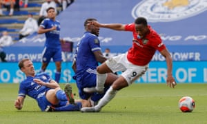 Anthony Martial of Manchester United is tackled by Wes Morgan of Leicester City leading to a penalty.