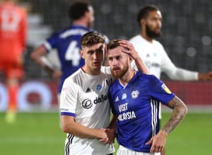 Fulham’s Tom Cairney (left) consoles Joe Ralls of Cardiff City.
