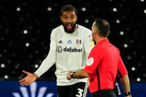 Michael Hector of Fulham questions a decision from the referee.