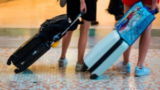 Holidaymakers with baggage