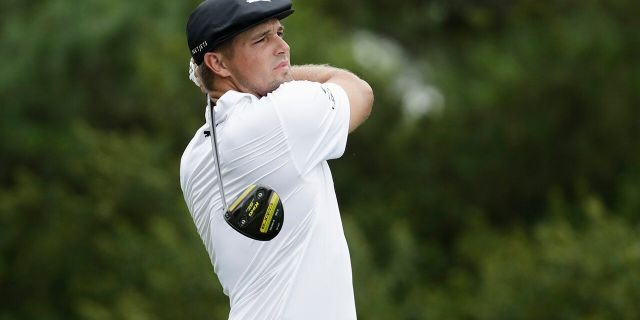 Bryson DeChambeau watches his tee shot on the 17th hole during the first round of the World Golf Championship-FedEx St. Jude Invitational Thursday, July 30, 2020, in Memphis, Tenn. (AP Photo/Mark Humphrey)