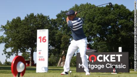 DeChambeau tees off on the 16th hole of the final round of the Rocket Mortgage Classic in Detroit.