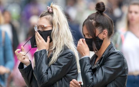 Shoppers wear protective face masks in Edinburgh's Princes Street.