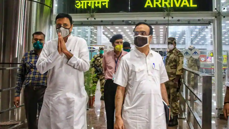 Senior Congress leaders Randeep Surjewala and Ajay Maken arrive at Jaipur Airport on Sunday.