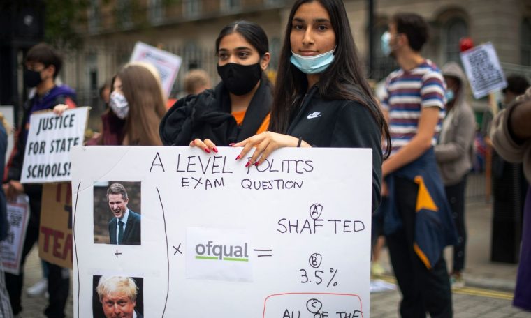 Students take part in a protest in Westminster in London over the government's handling of A-level results