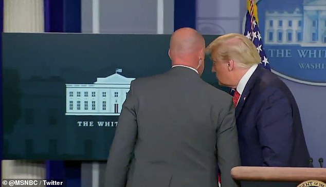 Shorty after he began speaking to the press, a Secret Service agent came into the press briefing room to whisper in President Donald Trump's ear
