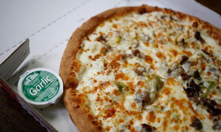 Americans can't stop shoving pizza into their faces