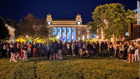 Syracuse University students gather Wednesday evening.