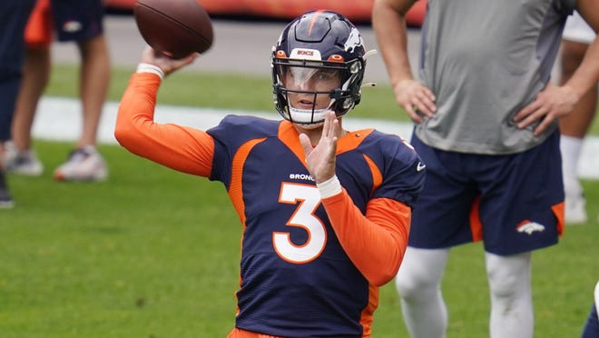 The Denver Broncos quarterback Drew Lock participates during practice on August 29, 2020 at the empty Empower Field at Mile High in Denver.