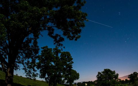 The International Space Station is seen in this 30 second exposure as it flies over Elkton, VA early in the morning, Saturday, August 1, 2015.