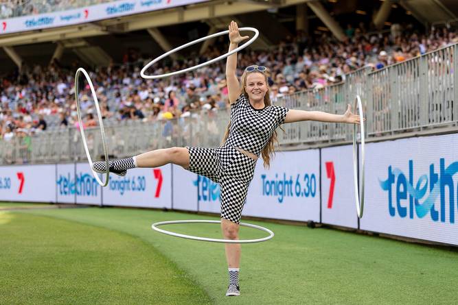 Demi Skinner, a tick tock star with 2.2 million followers, performs with hoops at the Telithon Family Festival at Optus Stadium.