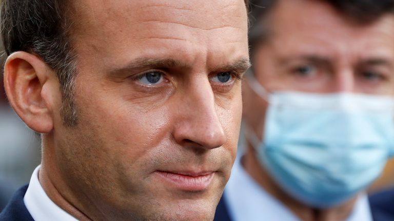 French President Emmanuel Macron is watching as he talks to the media during a meeting on October 29, 2020 at the Notre Dame Church in Nice, France.