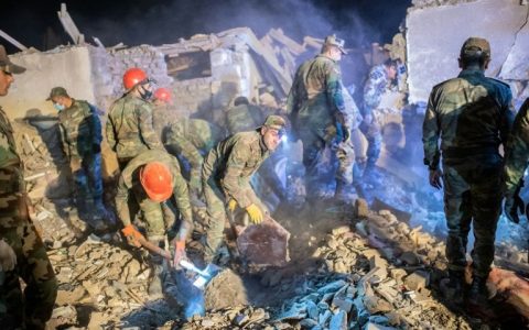 Rescue teams sift through rubble of a missile that struck the Azerbaijani city of Ganja