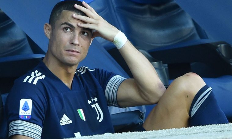 Cristiano Ronaldo watches on after coming off against Lazio with an injury