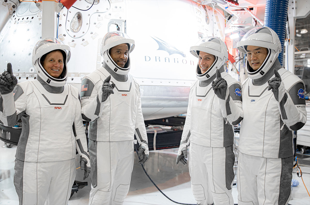 SpaceX's Crew-1 astronauts, including NASA astronauts Shannon Walker, Victor Glover and Michael Hopkins, and Jaxa astronaut Sochi Noguchi, in front of their dragon capsule, "Flexibility," At SpaceX's headquarters in Hawthorne, California.