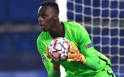Black goalkeeper and the sky playing field of Europe