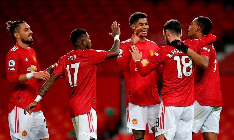 Manchester United moved within a point of Leicester in second with a 6-2 thrashing of Leeds United at Old Trafford