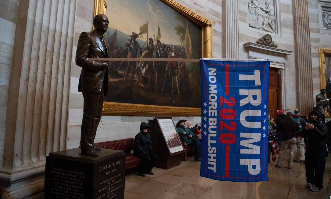 Protesters breached security and entered the Capitol, while Congressmen debated attesting Joe Biden's victory in the presidential election Photo: SAUL LOEB / AFP