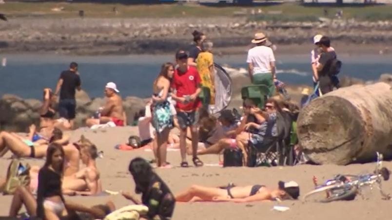 People on the beach in British Columbia, Canada during a heat wave