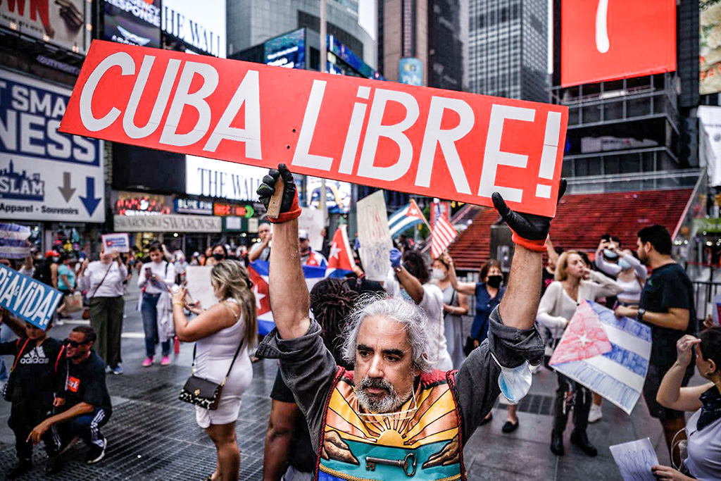 Protesters in New York's Times Square support anti-government demonstrations in Cuba