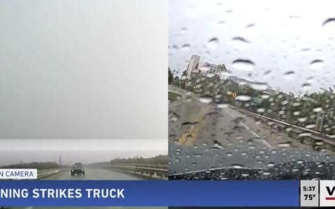 Lightning strikes a moving pickup truck in Florida and is recorded on video