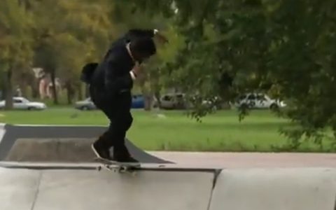 Reporter "takes the waves" on a skateboard during a live story in the United States