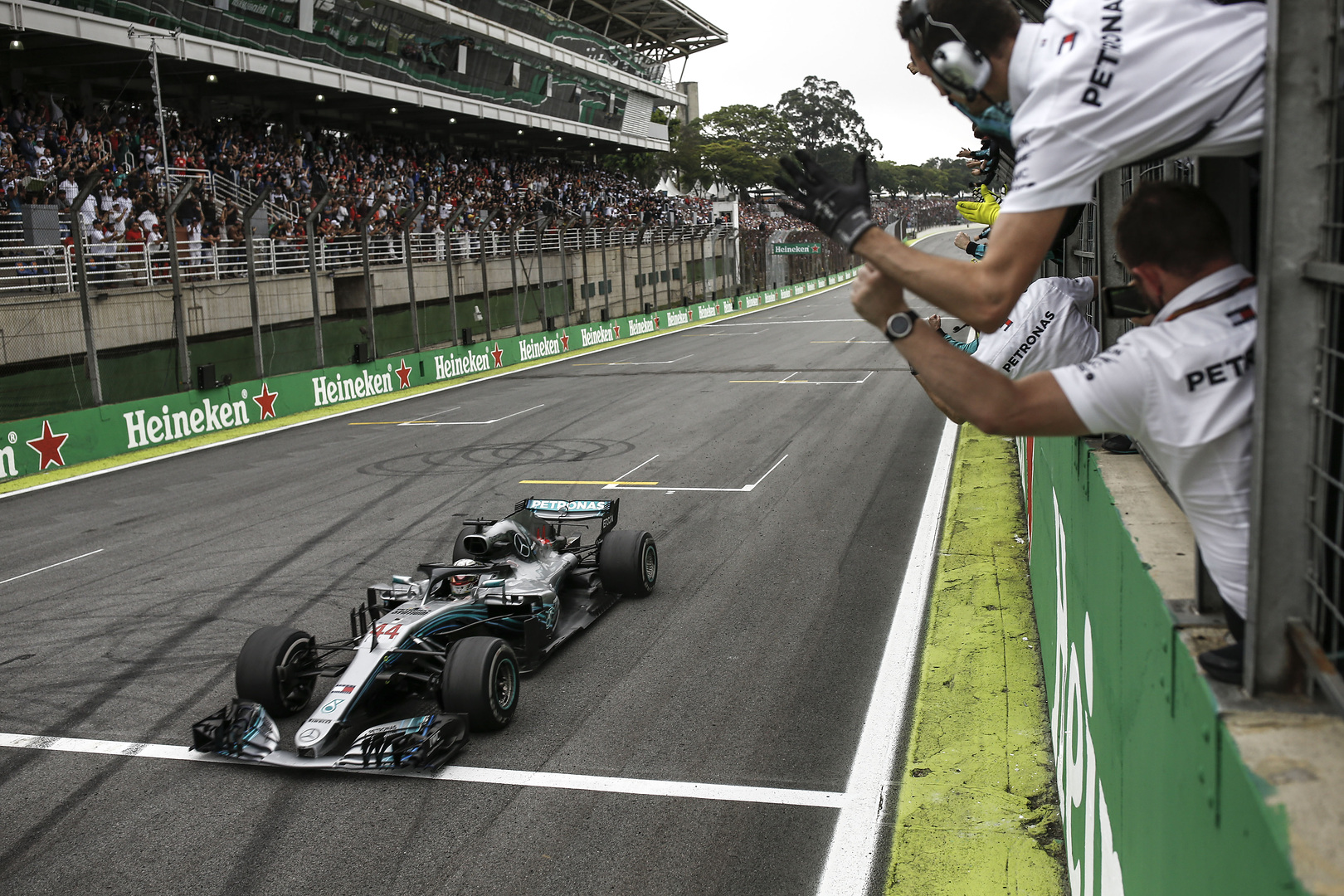 The Mercedes team celebrates victory at the 2018 Brazilian GP at Interlagos