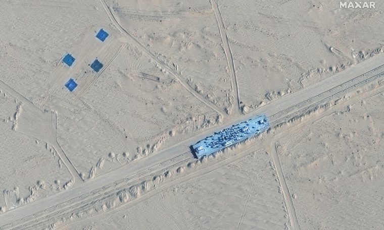 Satellites show full-size models of US military ships set in the desert of China.  World