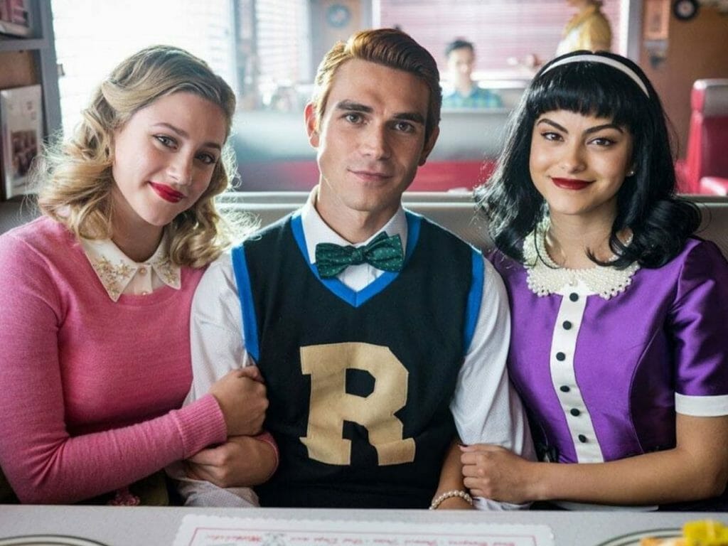 Lili Reinhart, KJ Apa and Camila Mendes with a vintage look