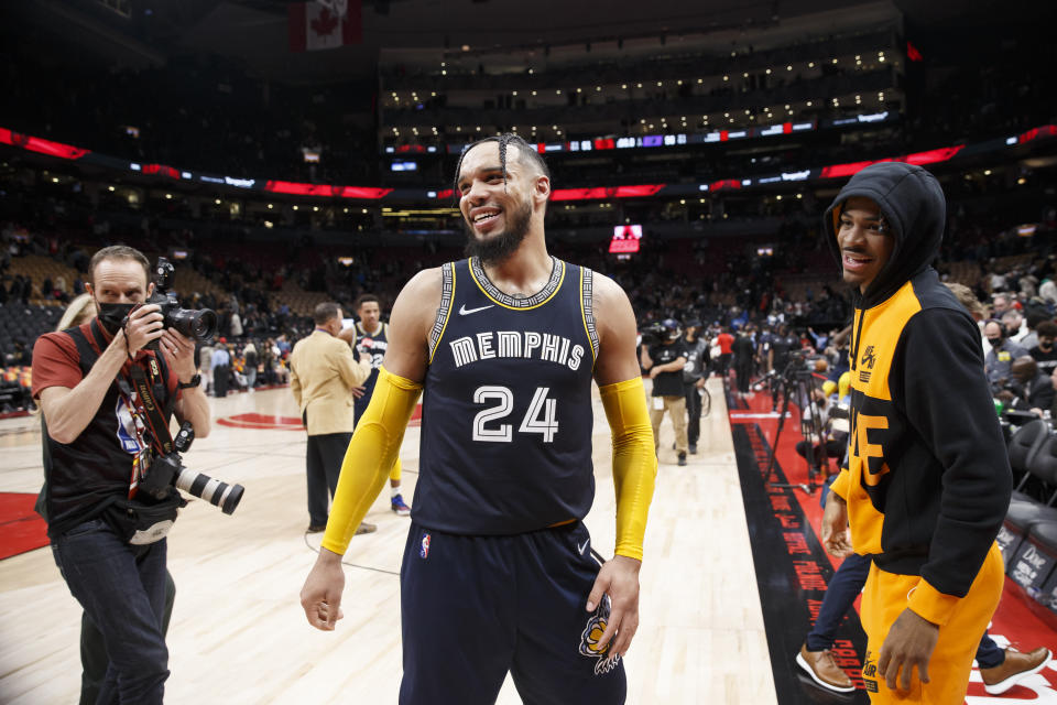 TORONTO, ON - NOVEMBER 30: Dylan Brooks #24 of the Memphis Grizzlies smiles to the crowd with Jaa Morant #12 of the Memphis Grizzlies after their NBA game win over the Toronto Raptors at Scotiabank Arena on November 30, 2021 in Toronto, Canada Huh.  ,  Note to User: User expressly acknowledges and agrees that, by downloading or using this Image, User is consenting to the terms and conditions of the Getty Images License Agreement.  (Photo by Cole Burston/Getty Images)