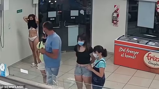 Video: Woman wears dress as mask and enters ice cream parlor in only lingerie